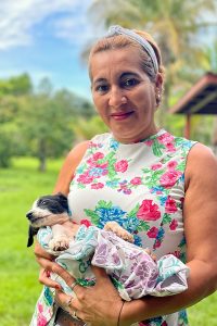 woman in Panama holding a puppy