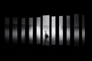 black and white silhouette streaks of light walking