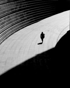black white silhouette photograph person walking